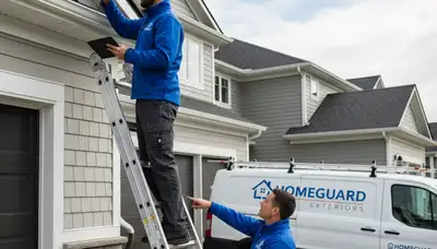 Technician performing gutter inspection on Boston, MA home with vinyl siding exterior